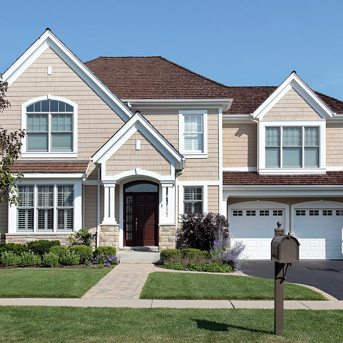 Home with brown cedar roof